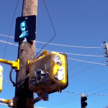 Tattered posters surround fallen star